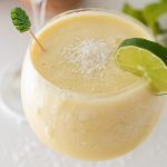 Banana Pina Colada in glass with a slice of lime