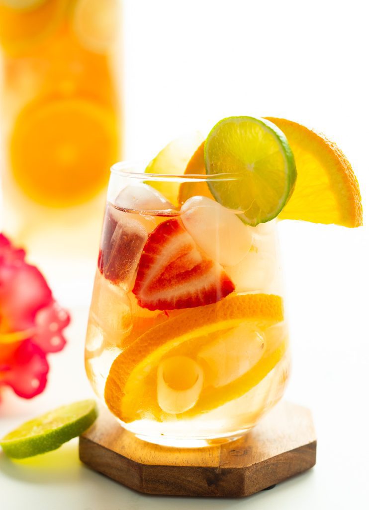 Non alcoholic sangria mocktail in glass with citrus and berries