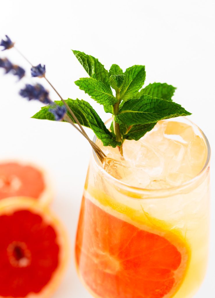 grapefruit mocktail with lavender and mint sprigs