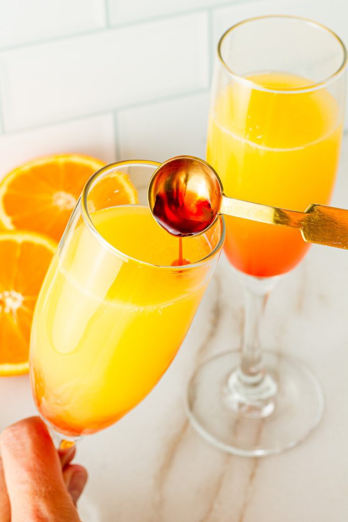 Pour granadine down the inside of the glass