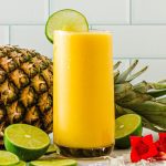 Blending fresh mango puree for easy tropical mocktail
