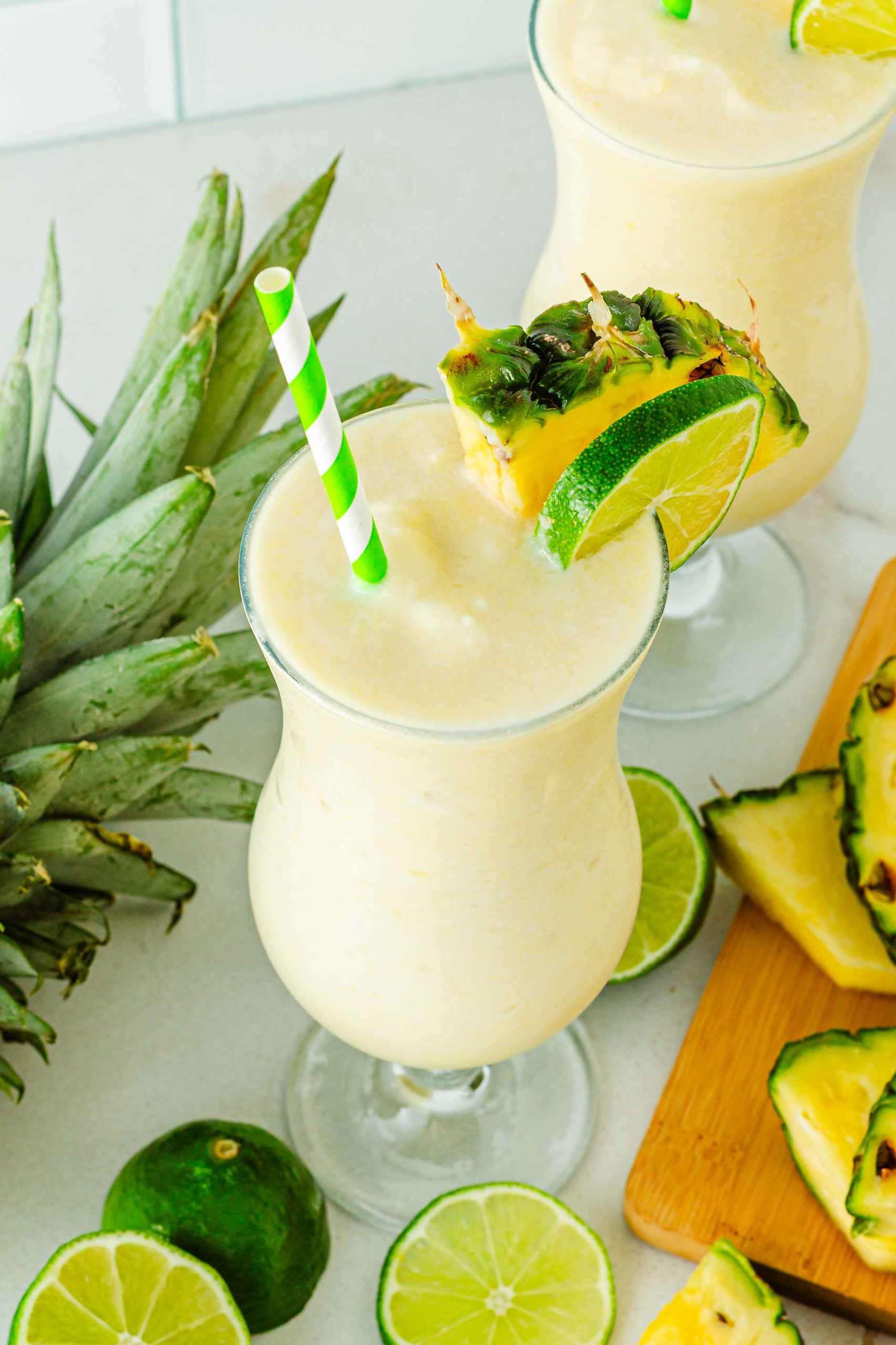 Virgin Pina Colada in glass with green and white straw