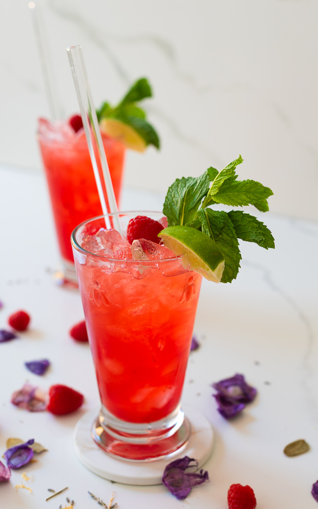 two glasses of raspberry mojito mocktail