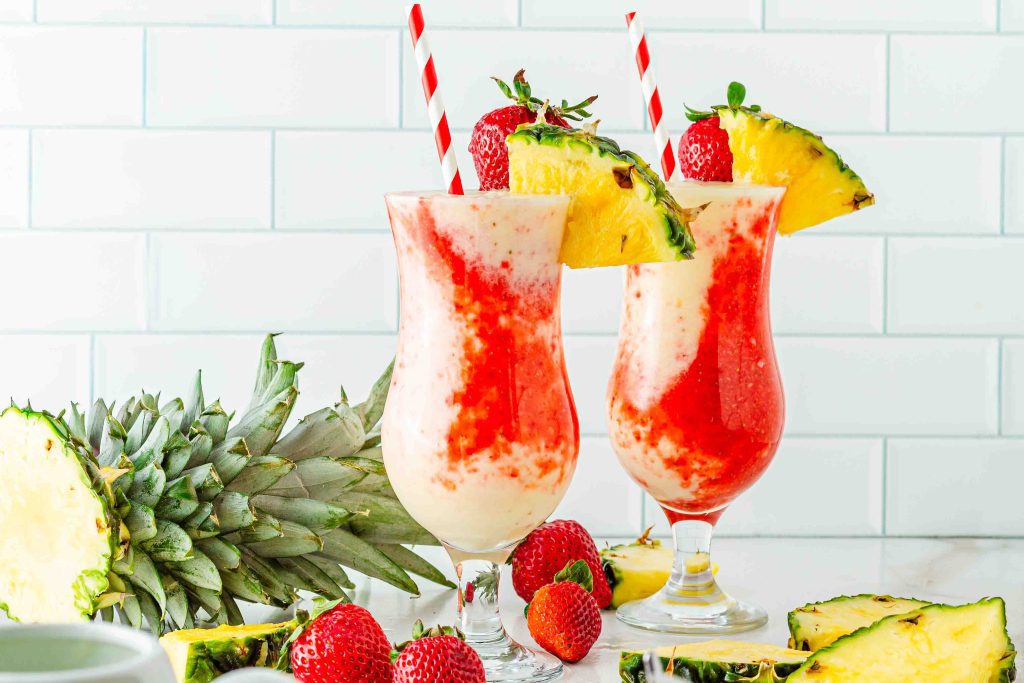 two glasses of tropical mocktails with pineapple