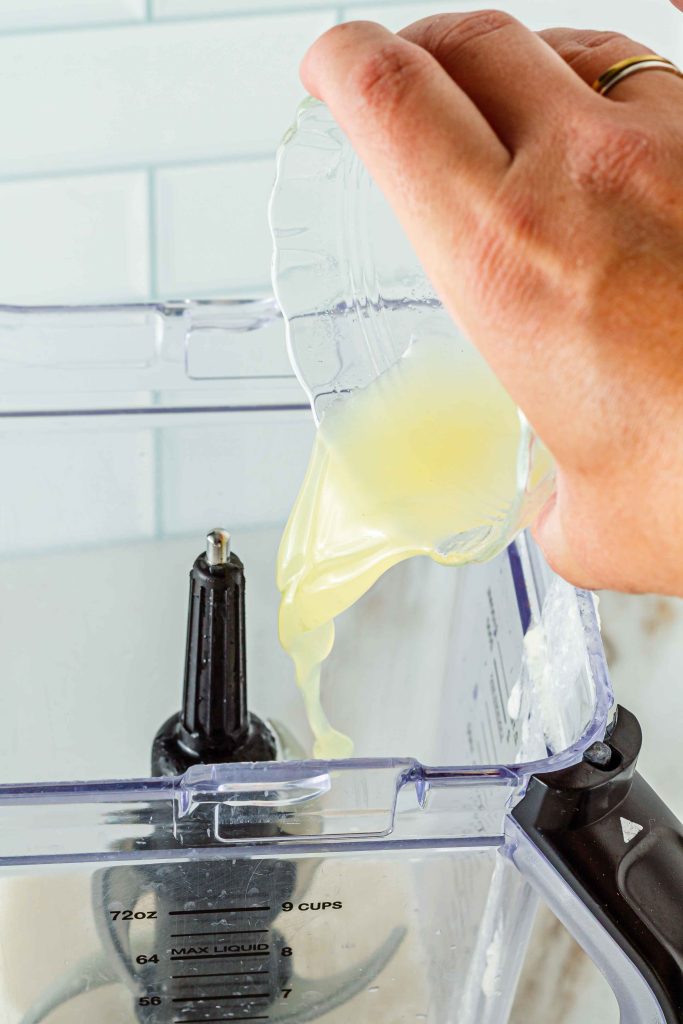 Adding Pineapple Juice To Blender