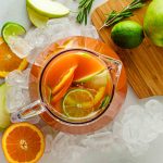 Pitcher of fruit punch with limes and ice