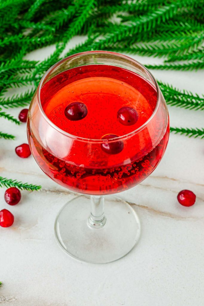 Wine glass filled with sparkling cranberry mocktail