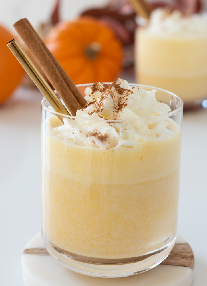Glass of Pumpkin Nog Holiday Mocktail with whipped cream