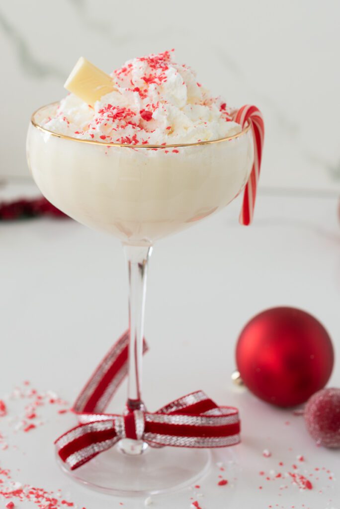 Martini Glass of Christmas M ocktail with white chocolate and peppermint