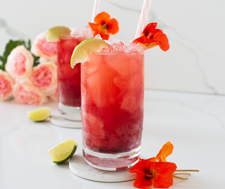 Pink Mocktail with fresh flowers and citrus