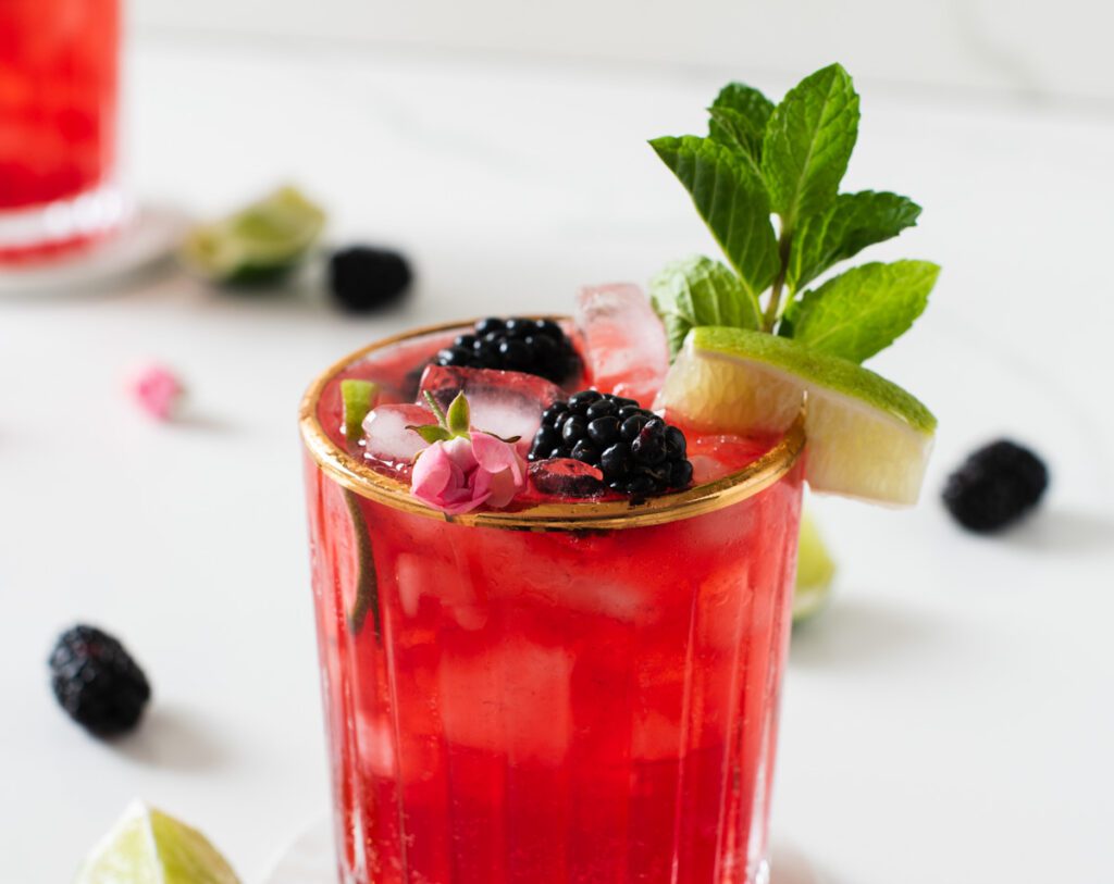 close up of blackberry mojito mocktail with fresh blackberries 