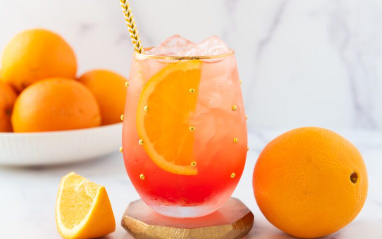glass of Aperol Spritz Mocktail with fresh oranges