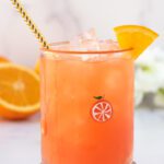 glass of virgin margarita with citrus and gold straw