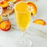peach bellini mocktail with fresh blossoms