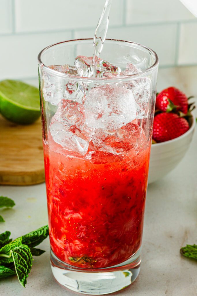 Add ice and sparkling water
