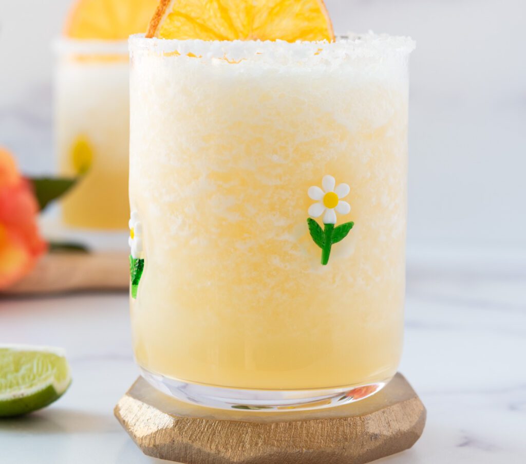 virgin lime margarita in flowered glass with a citrus slice