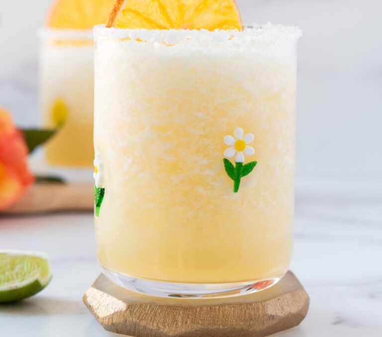 virgin lime margarita in flowered glass with a citrus slice