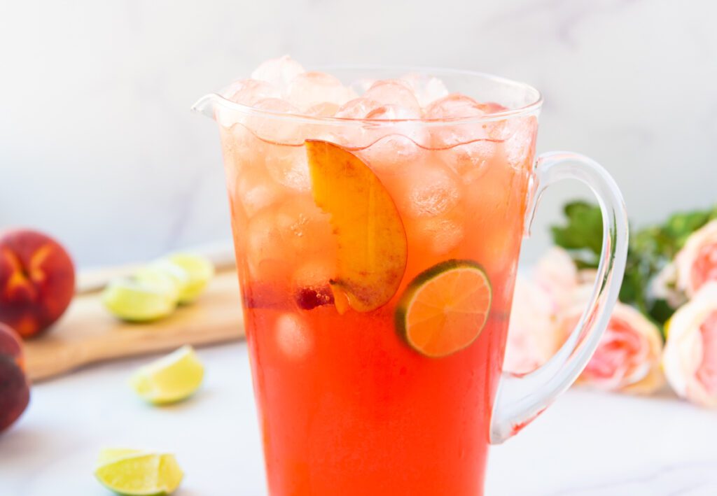 pitcher of peach margarita mocktail
