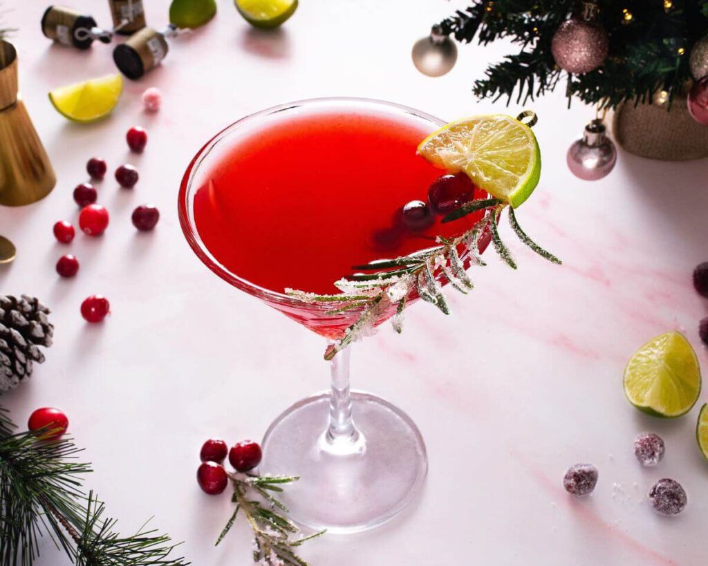 non-alcoholic gin mocktail bright red color with holiday greens